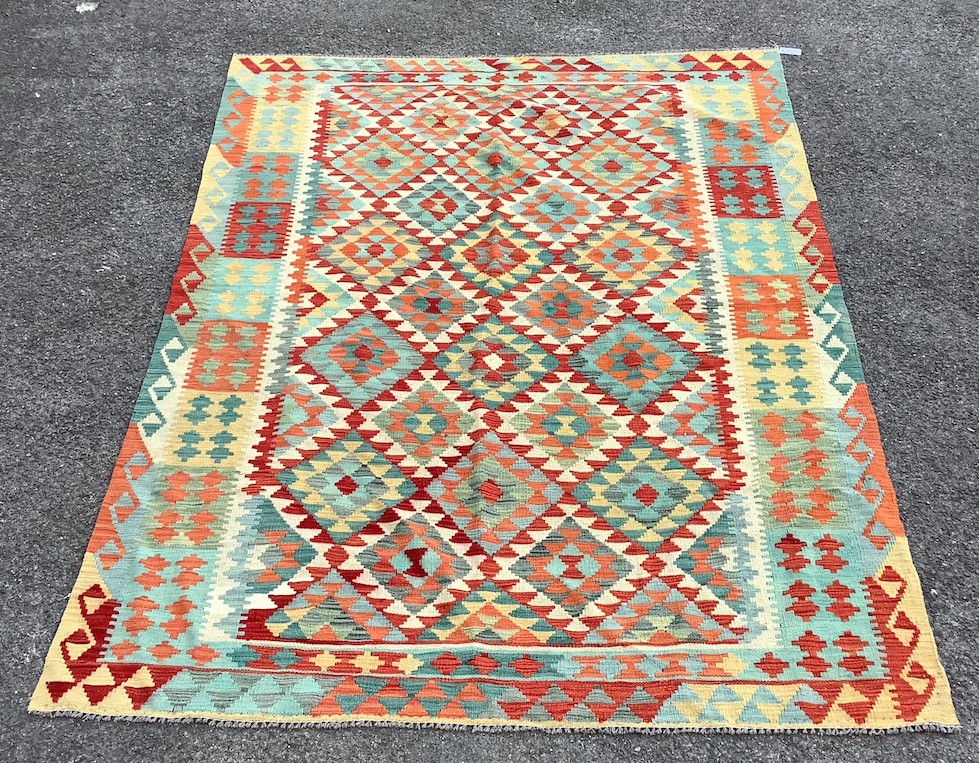 An Anatolian style polychrome Kilim flatweave carpet, 254 x 185cm